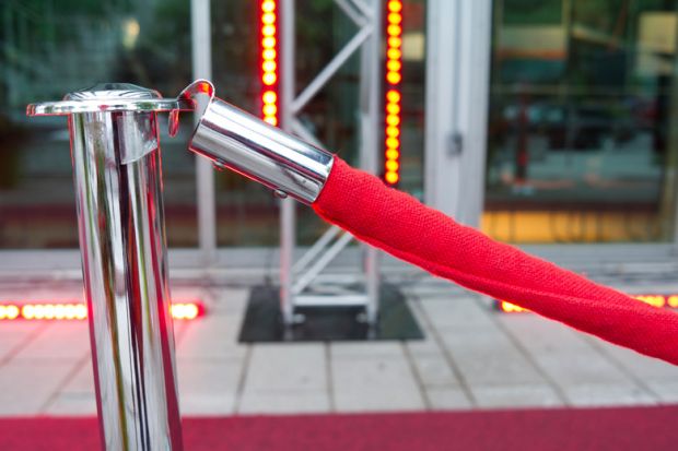 Red velvet ropes outside VIP event venue Red velvet ropes outside VIP event venue