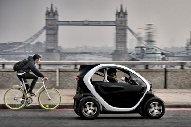 Renault Twizy electric car and cyclist on London Bridge