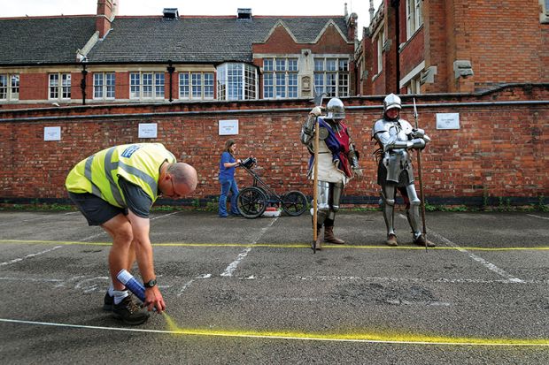 Claire Graham uses ground penetration radar (GPR) at Greyfriars car park in Leicester watched by actors dressed as Knights from Historic Equitation Ltd during an archaeological search for the lost grave of Richard III
