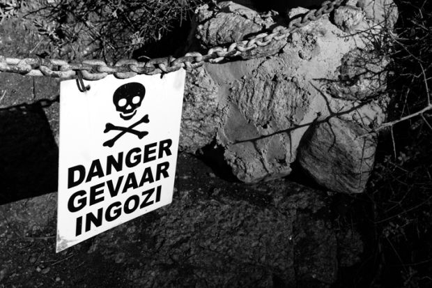 sign with the word danger written in three languages. English, Afrikaans, Zulu