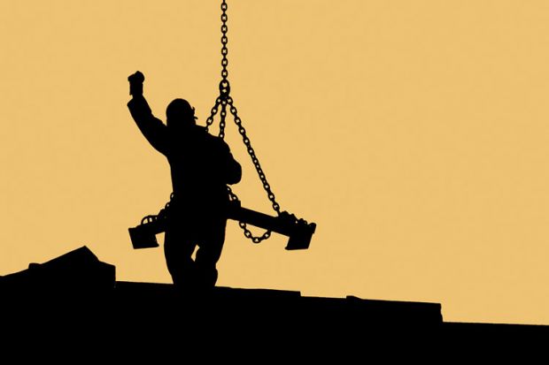 Sillhouette of construction worker handling crane load