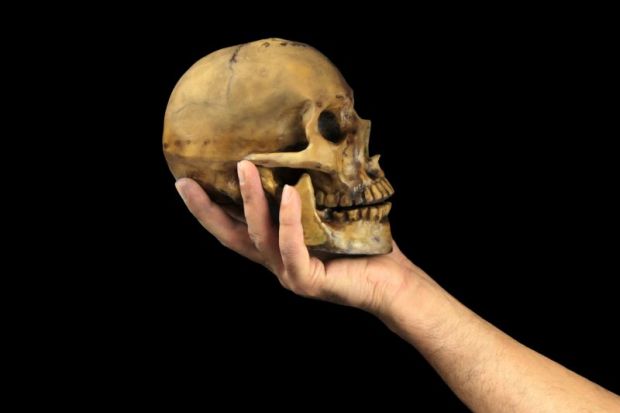A skull in hand