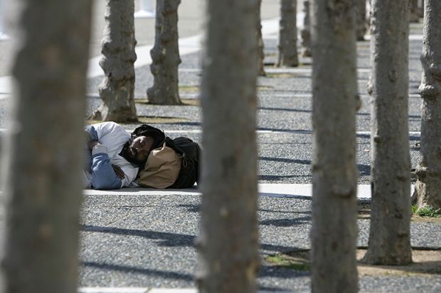 Homeless man sleeping outside