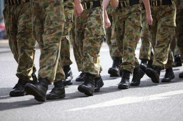 Soldiers in camouflage fatigues marching Soldiers in camouflage fatigues marching