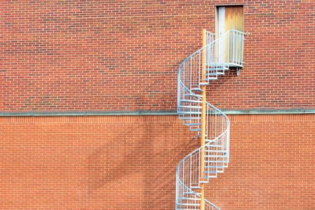 Spiral staircase by an exit door Spiral staircase by an exit door