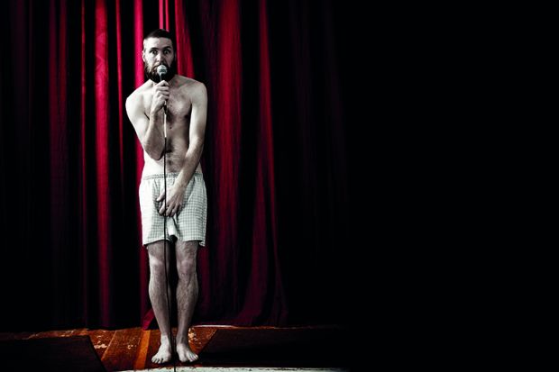 Man standing in boxer shorts on stage illustrating feature article about worst university teaching moments