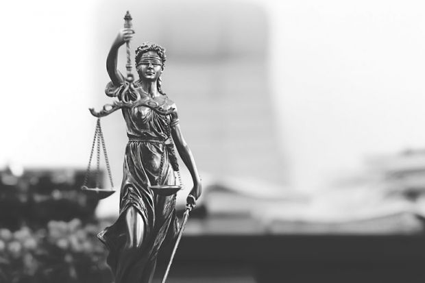 Statue of Lady Justice in academic's office Statue of Lady Justice in academic's office