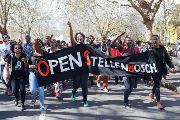 Students hold banners during a demonstration against Stellenbosch University in Cape Town, 2015.