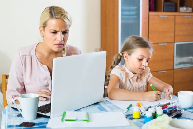 stressed-woman-with-child-working-from-home
