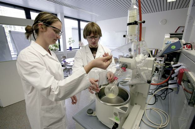 Student pharmacists at work in laboratory