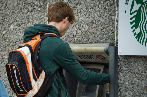 Student withdrawing money from ATM