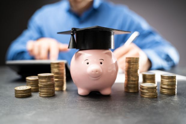 A piggy bank with a mortar board A piggy bank with a mortar board