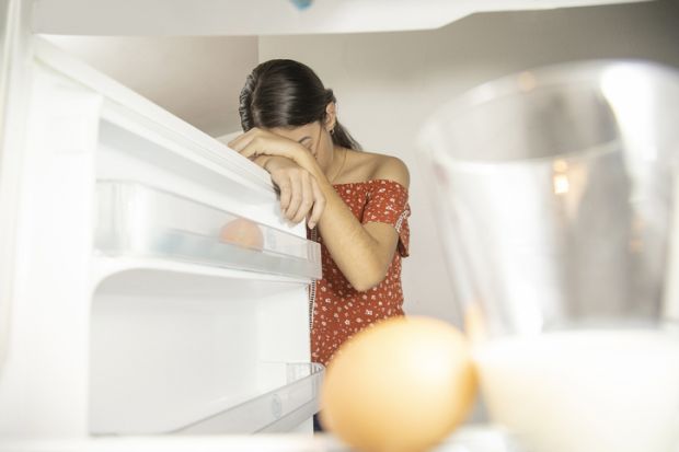 A student depressed by an empty fridge