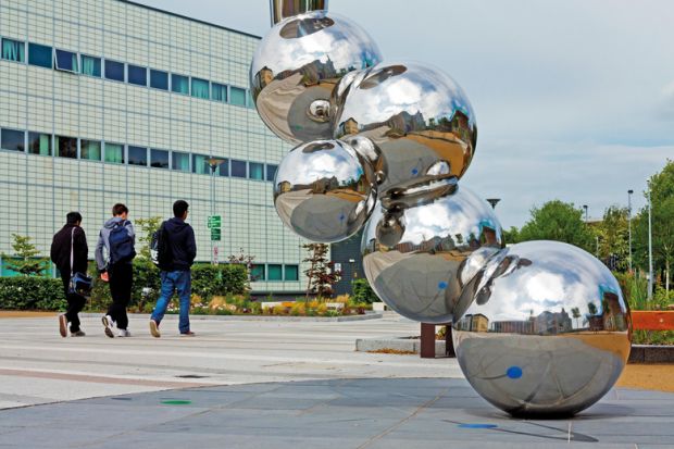 Students walking past sculpture, Loughborough University Students walking past sculpture, Loughborough University