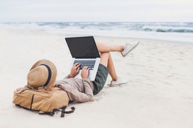 Working with a laptop on the beach