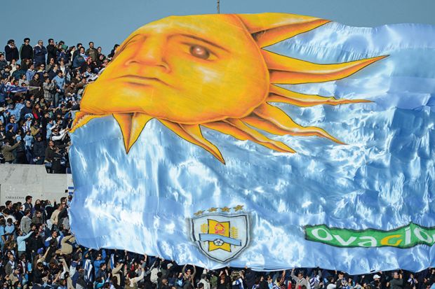 A flag passes over the crowd in Uruguay