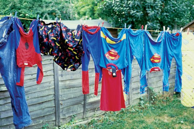 Superhero costumes hanging on a washing line