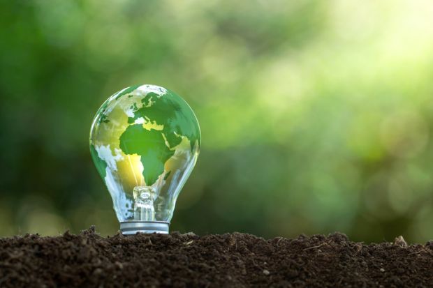 A lightbulb with a green earth on it, symbolising sustainable development