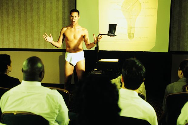 A man lecturing in his underwear
