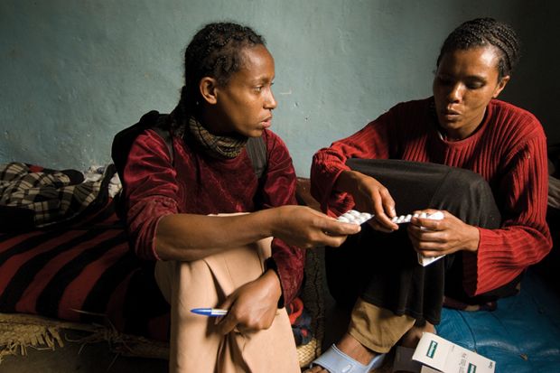 Ethiopian women holding medicine