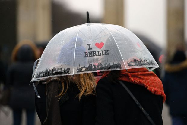 Women under “I love Berlin” umbrella