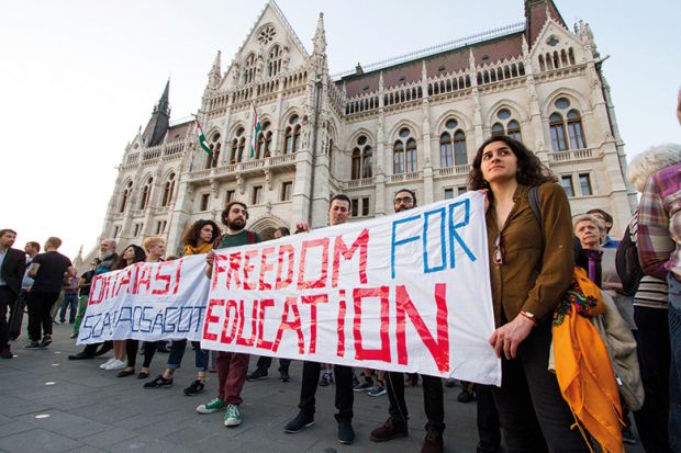People participate in a demonstration to show support and solidarity with the Central European University (CEU) in Budapest
