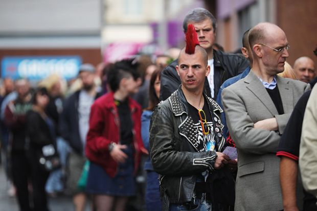 Punk standing in a queue