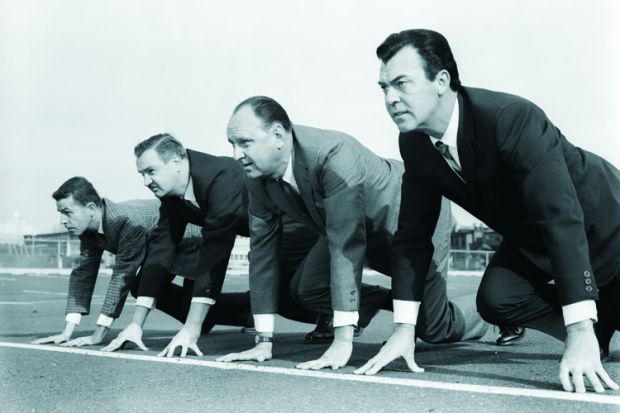 Businessmen on racetrack start line