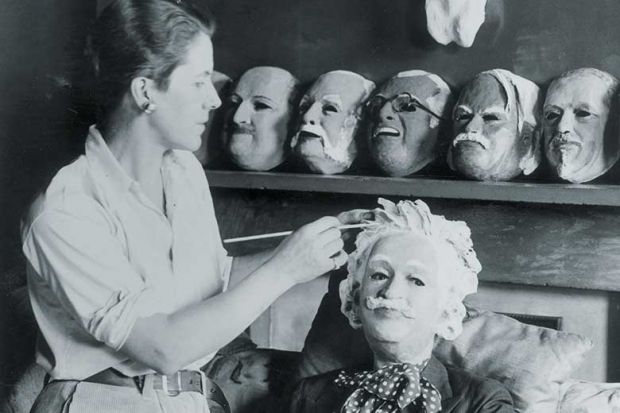 Woman making a mask of Albert Einstein