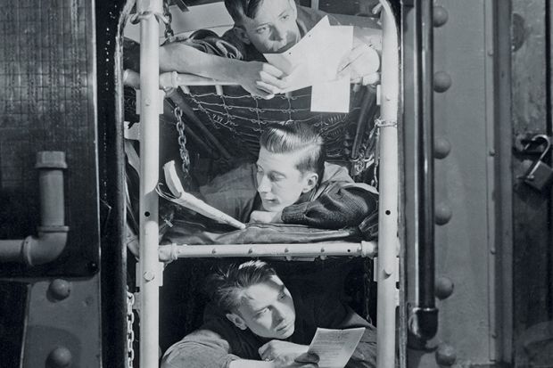 Sailors in bunk beds in submarine