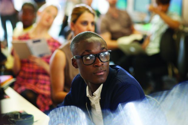 Male university student listening to seminar Male university student listening to seminar