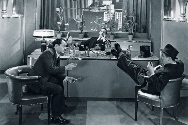 men in office with feet on desk. Vintage
