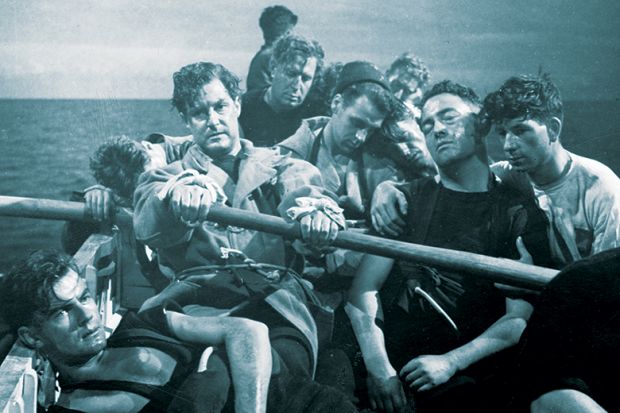1945:  Torpedoed in the Mediterranean sea, Robert Donat (rowing) and the crew take to the life boats. Alf Goddard is in the background, and Harry Ross is second from left. From the film 'Perfect Strangers', directed by Alexander Korda for London Films.