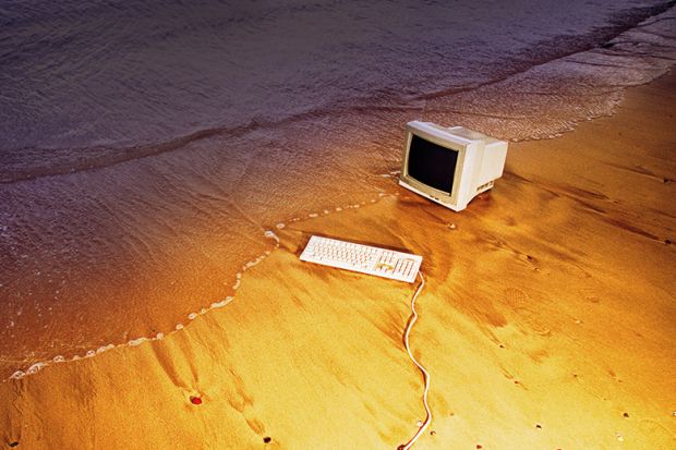 Old computer on beach