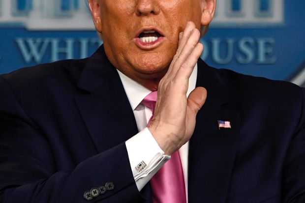 US President Donald Trump gestures as he speaks during a news conference on the COVID-19 outbreak at the White House on February 26, 2020