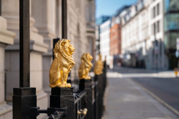 The Law Society is the governing body for Solicitors in England and Wales. Its headquarters are located in Chancery Lane, London. This image depicts golden gilded lions adorning the tops of iron railings. They were designed by Alfred Stevens and are ident
