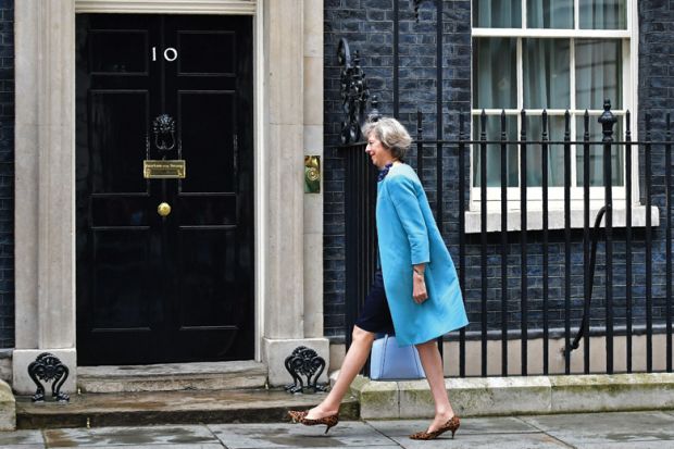 Theresa May entering 10 Downing Street, London