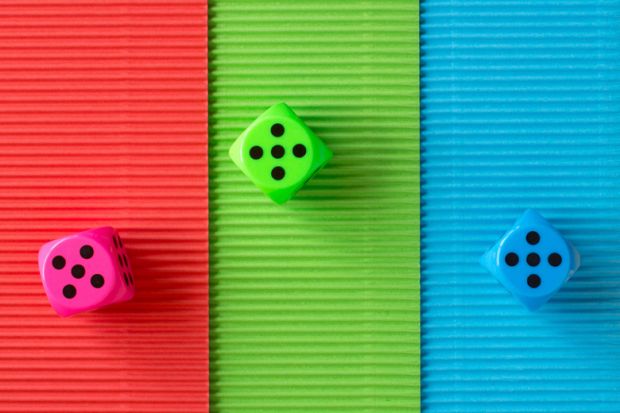 Three coloured dice rolling five