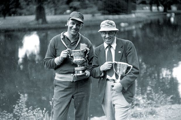 Two men with trophies Two men with trophies