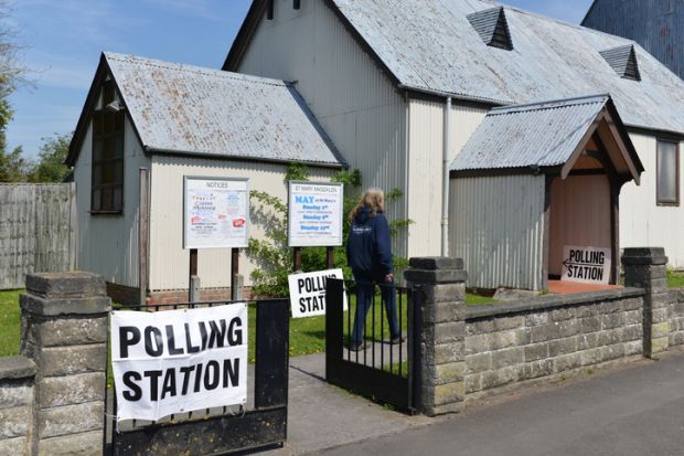 Trowbridge, UK - May 5, 2016 A voter visits a polling station at a church. Trowbridge, UK - May 5, 2016 A voter visits a polling station at a church.