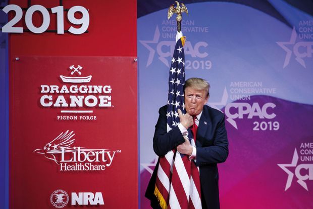 Trump hugging flag