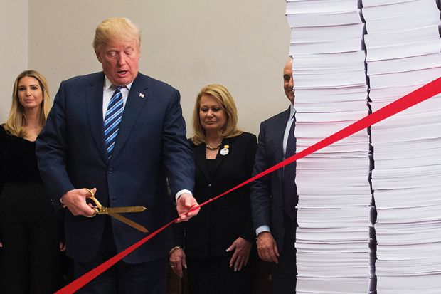 Former US president Donald Trump cutting ribbon