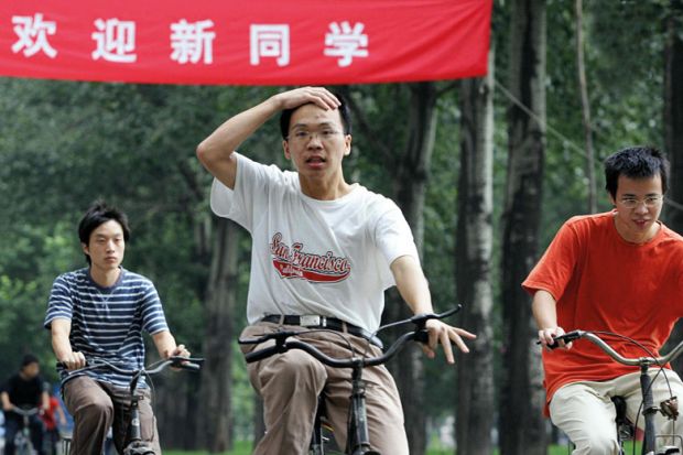 Tsinghua University students riding bicycles on campus