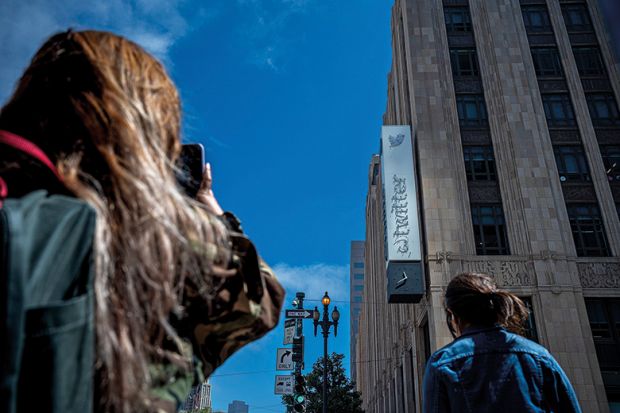 A partially removed sign at Twitter headquarters in San Francisco, California, US, on Wednesday, July 26, 2023. Elon Musk has changed Twitter Inc.'s logo, replacing its signature blue bird with a stylized X