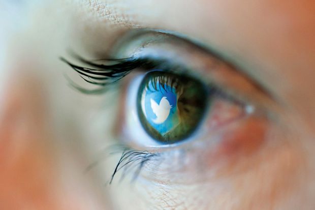 Twitter logo reflected on person's eye