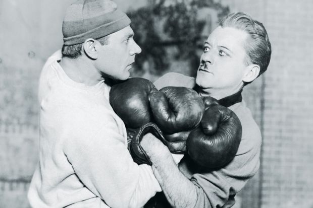 Two boxers tussling during fight
