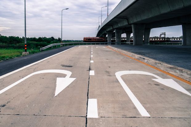 U-turn road markings under elevated carriageway