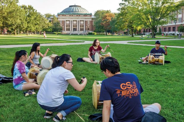 University of Illinois at Urbana-Champaign students playing drums University of Illinois at Urbana-Champaign students playing drums