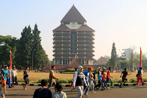 People jogging in front of rectorate building of Universitas Indonesia, Depok, Indonesia.