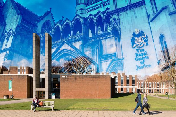 General exterior view of campus at the University of Sussex, Brighton and Hove, UK, with the Royal Courts of Justice superimposed.